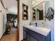 Bright bathroom with vanity, mirror and view to bedroom area at 3769 Bay Creek Church Rd, Loganville, GA 30052