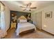 Cozy bedroom with stylish decor, and a large window for natural light at 3769 Bay Creek Church Rd, Loganville, GA 30052