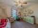 Well-lit bedroom featuring a dollhouse and a playful layout, creating a delightful and imaginative space at 3769 Bay Creek Church Rd, Loganville, GA 30052
