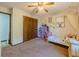 Bright bedroom with a dollhouse, natural light, and neutral paint, creating a serene and playful atmosphere at 3769 Bay Creek Church Rd, Loganville, GA 30052