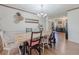 Dining room with wood table, chandelier, and wall decor at 3769 Bay Creek Church Rd, Loganville, GA 30052