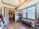 Inviting entry way with bright natural light, bench seating and room for plants at 3769 Bay Creek Church Rd, Loganville, GA 30052