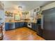 Kitchen with wood countertops, stainless steel appliances and blue cabinets at 3769 Bay Creek Church Rd, Loganville, GA 30052