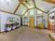 Bright and airy living room with vaulted ceilings, exposed beams, and natural light at 3769 Bay Creek Church Rd, Loganville, GA 30052