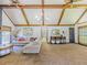 Inviting living room with vaulted ceilings, wood beams, and stylish furnishings at 3769 Bay Creek Church Rd, Loganville, GA 30052