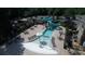 Aerial view of the community pool, playground, and seating areas, surrounded by lush landscaping at 8970 Moor Park Run, Duluth, GA 30097