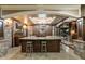 Finished basement bar features stone accents, granite countertops, and custom cabinetry at 8970 Moor Park Run, Duluth, GA 30097