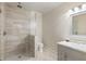 Bathroom features a glass enclosed shower with neutral tile surround, and marble vanity at 8970 Moor Park Run, Duluth, GA 30097