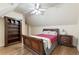 Comfortable bedroom with hardwood floors, sloped ceilings, a bookcase, and a restful ambiance at 8970 Moor Park Run, Duluth, GA 30097