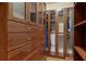 Walk-in closet with custom shelving and storage at 8970 Moor Park Run, Duluth, GA 30097