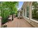 Outdoor deck is built with brick columns and offers views of wooded backyard at 8970 Moor Park Run, Duluth, GA 30097