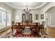 Bright dining room with hardwood floors, chandelier and plenty of natural light at 8970 Moor Park Run, Duluth, GA 30097