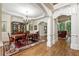 Elegant dining room featuring hardwood floors, crown molding and chandelier at 8970 Moor Park Run, Duluth, GA 30097