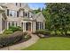 Close-up of a brick home featuring lovely landscaping and an inviting walkway at 8970 Moor Park Run, Duluth, GA 30097