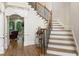 Foyer with stairway, hardwood floors and living room views at 8970 Moor Park Run, Duluth, GA 30097