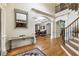Spacious foyer with hardwood floors, archway and view into the dining room at 8970 Moor Park Run, Duluth, GA 30097