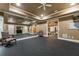 Home gym featuring mirrored wall, rubber floor and plenty of space for workout equipment at 8970 Moor Park Run, Duluth, GA 30097
