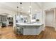 Beautiful kitchen featuring granite countertops, stainless steel appliances, and a view into the living room at 8970 Moor Park Run, Duluth, GA 30097