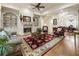 Spacious living room with fireplace, built-in shelving, and comfortable seating on a beautiful rug at 8970 Moor Park Run, Duluth, GA 30097