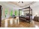 Spacious main bedroom with tray ceiling, hardwood floors and exterior access at 8970 Moor Park Run, Duluth, GA 30097