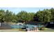 Community tennis courts with well-maintained courts and shaded seating areas at 8970 Moor Park Run, Duluth, GA 30097