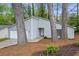 Charming single-story home featuring a light gray exterior, well-maintained landscaping, and an attached garage at 1360 Terramont Dr, Roswell, GA 30076