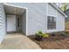 A welcoming front entrance with a well-kept garden bed adds charm to this lovely home at 1360 Terramont Dr, Roswell, GA 30076