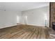Bright living area with vaulted ceilings, modern lighting, and a striking stone fireplace creates a warm ambiance at 1360 Terramont Dr, Roswell, GA 30076