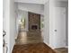Inviting living room showcasing hardwood floors, a cozy fireplace, and abundant natural light from the windows at 1360 Terramont Dr, Roswell, GA 30076