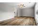 Spacious bedroom with ceiling fan, hardwood floors, and ensuite bathroom with marble tile at 1360 Terramont Dr, Roswell, GA 30076