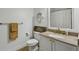 Stylish bathroom featuring granite countertops, white vanity and a decorative mirror at 2700 Pine Tree Rd # 3006, Atlanta, GA 30324