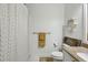 Well-lit bathroom with a shower, patterned curtain, and a vanity with granite countertops at 2700 Pine Tree Rd # 3006, Atlanta, GA 30324