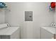 Practical laundry area with shelving above the front loading washer and dryer providing extra storage space at 2700 Pine Tree Rd # 3006, Atlanta, GA 30324