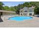 Inviting outdoor swimming pool with surrounding patio and a clubhouse perfect for relaxation and recreation at 2700 Pine Tree Rd # 3006, Atlanta, GA 30324