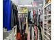 Organized walk-in closet featuring clothing racks, shelves, and storage for shoes and personal items at 2700 Pine Tree Rd # 3006, Atlanta, GA 30324