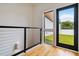 Balcony with wood flooring, metal railing, and a view of the backyard and lawn at 367 Parkway Ne Dr # 5, Atlanta, GA 30312