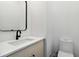 Modern half bath featuring a floating vanity and a white elongated toilet at 367 Parkway Ne Dr # 5, Atlanta, GA 30312