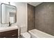 Bathroom showcasing tub, modern vanity, and gray tile at 367 Parkway Ne Dr # 5, Atlanta, GA 30312