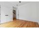 Bedroom with hardwood floors, closet with sliding doors and access to the staircase at 367 Parkway Ne Dr # 5, Atlanta, GA 30312