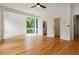Spacious bedroom with a ceiling fan, hardwood floors and a large window for plenty of natural light at 367 Parkway Ne Dr # 5, Atlanta, GA 30312