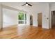 Bedroom features wood floors, white walls, a large window, and a ceiling fan at 367 Parkway Ne Dr # 5, Atlanta, GA 30312