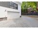 Paver driveway leading to an attached garage, complemented by landscaped features at 367 Parkway Ne Dr # 5, Atlanta, GA 30312