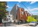 Corner lot modern townhome with a mix of siding and a wrought iron fence at 367 Parkway Ne Dr # 5, Atlanta, GA 30312