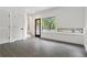 Bright entryway with neutral walls, gray tile flooring, big window and access to staircase at 367 Parkway Ne Dr # 5, Atlanta, GA 30312