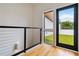 Upstairs hallway leading to patio with black framed door at 367 Parkway Ne Dr # 5, Atlanta, GA 30312