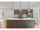 Modern kitchen features an island with a white countertop, wood cabinets, and stainless steel appliances at 367 Parkway Ne Dr # 5, Atlanta, GA 30312