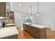 Modern kitchen features an island with a white countertop, wood cabinets, and stainless steel appliances at 367 Parkway Ne Dr # 5, Atlanta, GA 30312