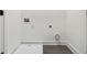 Clean laundry room with tile flooring, utility connections, and fresh white paint at 367 Parkway Ne Dr # 5, Atlanta, GA 30312