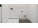 Laundry room features gray tile floor, white walls, and water hookups at 367 Parkway Ne Dr # 5, Atlanta, GA 30312