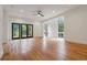 Open living room with hardwood floors, recessed lighting, and large windows at 367 Parkway Ne Dr # 5, Atlanta, GA 30312